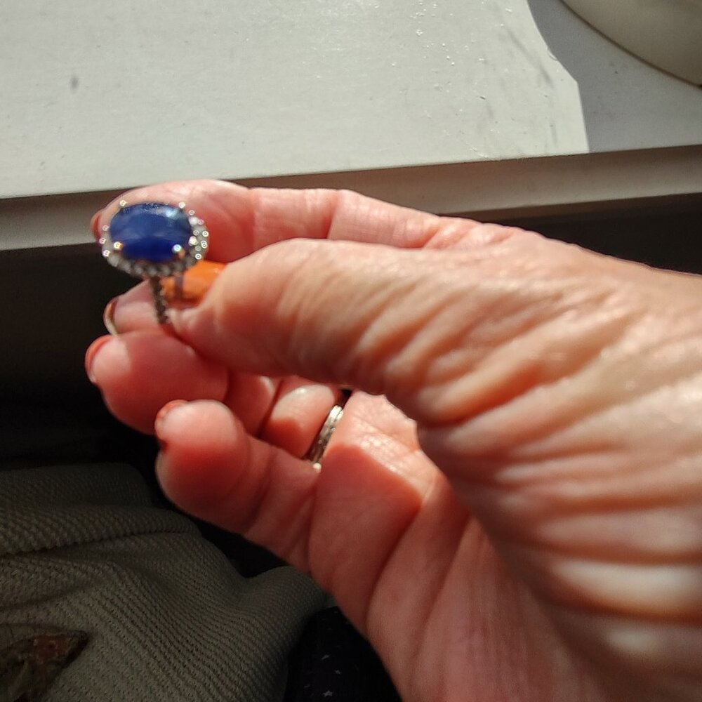 2 ct. Sapphire Ring with small diamonds around.  White  14 kt gold